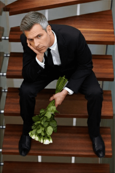 Midlife man reflecting on dating challenges.